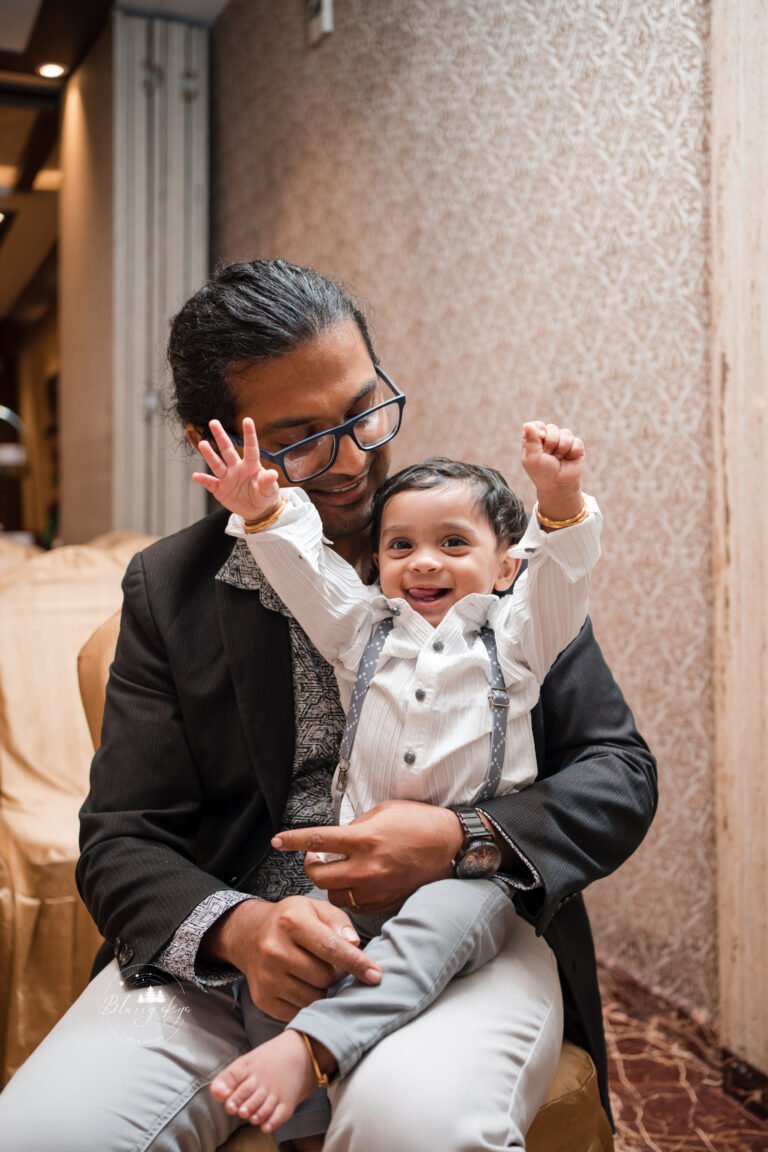 Baby happy in uncle's lap