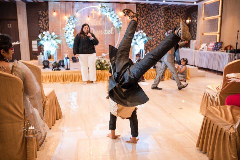 Young boy doing cartwheel during a reception game.