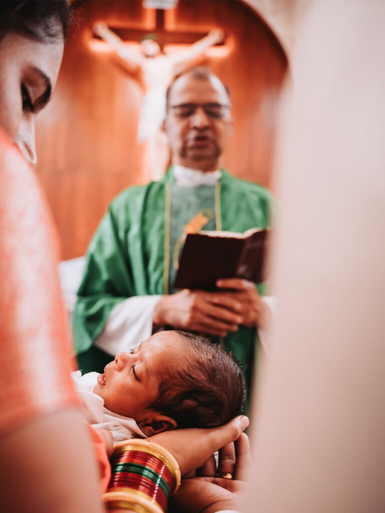 Creative photo of a mother holding her child with a priest and Jesus in the foreground