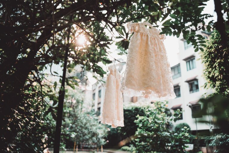 Beautifully captured image of white christening day outfits for baby girl twins, church ceremony attire