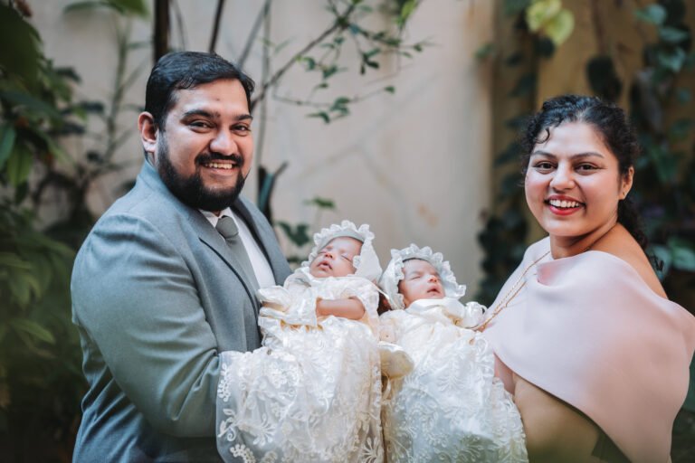 A traditional posing idea with couples holding their newborn babies