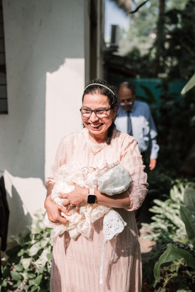 A happy grandma holding her grandson, radiating joy and love