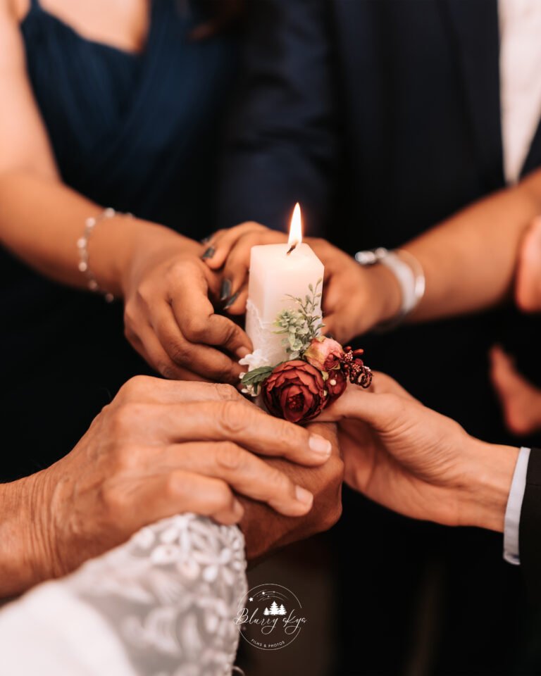 Aesthetic image of people holding a baptism candle, symbolizing unity in faith